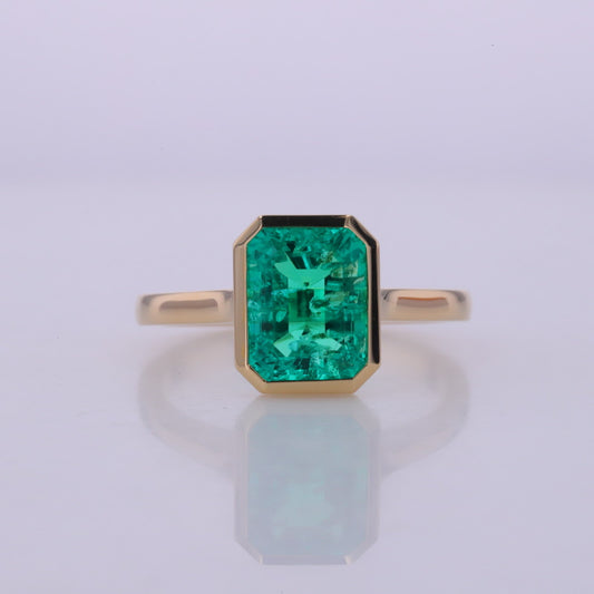 7*9mm emerald cut lab grown colombian emerald 10k yellow gold bezel ring